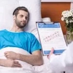 Sick patient in bed with doctor discussing reactions and side effects due to mercury toxicity