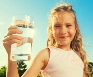 serious dentist talking to concerned patient about fluoride